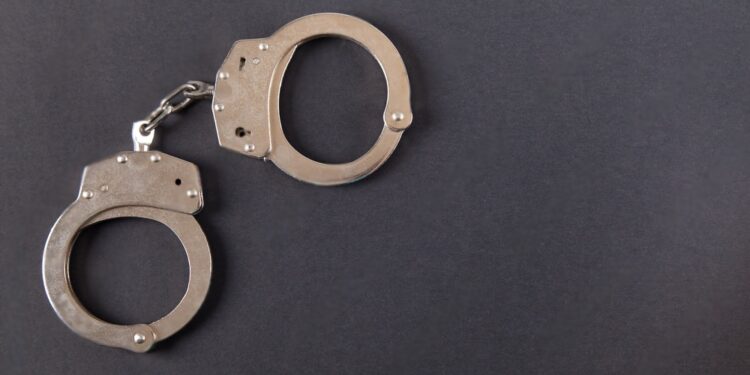handcuffs on a black table