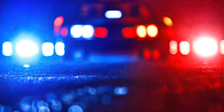 Blurred background of police flashing lights at the crime scene