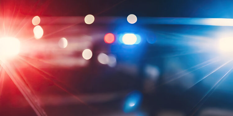 Blurred background of police flashing lights at the crime scene