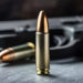 Close-up of a bullet and handgun, showcasing detail and precision in firearms and ammunition.