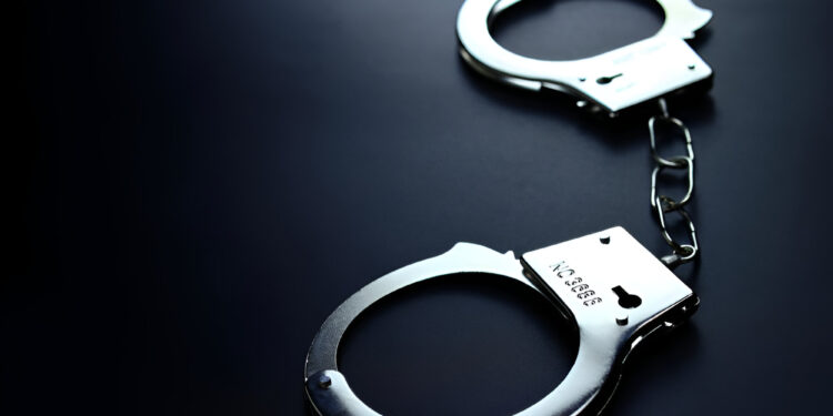 handcuffs dark background photo