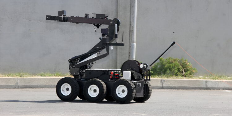 Terrorism. Bomb. Robot. A robot disarm a bomb inside a car of terrorists. Bomb squad robot.