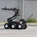 Terrorism. Bomb. Robot. A robot disarm a bomb inside a car of terrorists. Bomb squad robot.