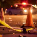 Traffic Cones and Caution Tape Surrounding an Accident Scene for Safety and Scene Management
