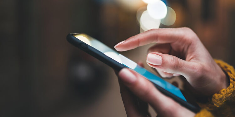 point finger on screen phone closeup, person texting text message