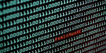 Ransomware or Wannacry text and binary code concept from the desktop screen. concept background, selective focus