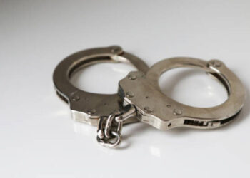 A single pair of closed handcuffs against a plain white background.