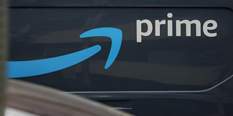 Amazon Prime logo on Amazon delivery truck, closeup.