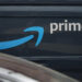 Amazon Prime logo on Amazon delivery truck, closeup.