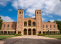 Exterior of Royce Hall building in the campus of UCLA with cloudy sky in the background during sunny day