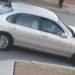 Surveillance image shows the suspect’s Toyota Avalon sedan with notable front-end damage. (Long Beach Police Department)