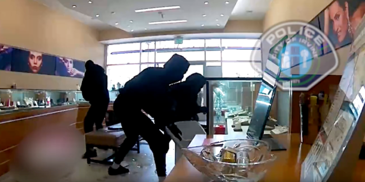 Three men were caught on video smashing display cases at an Irvine jewelry store on Aug. 1, 2023. (Irvine Police Department)