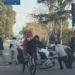 A group of 20 to 30 young bicyclists are seen assaulting a man during a confrontation (Image from LAPD Video)