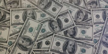 fake dollars in the ground
