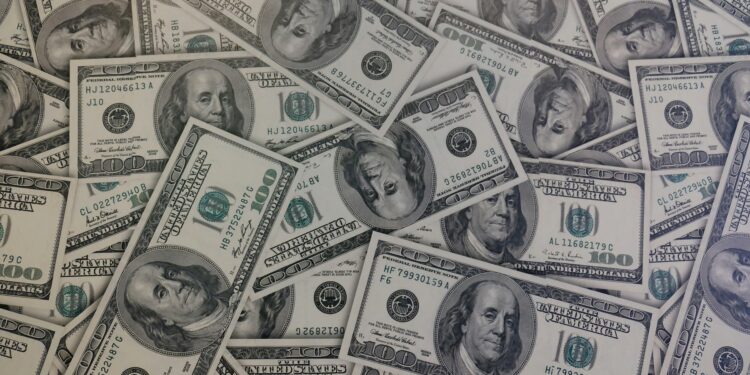 fake dollars in the ground