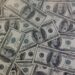 fake dollars in the ground