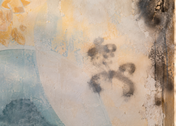 Close-up of a weathered mural wall with faded paint, light scorch marks and abstract spray-paint smudges, used as an illustrative image for a report on antisemitic vandalism at a Jewish temple site damaged by fire.