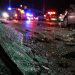 Close-up of shattered vehicle glass and damaged roadway debris beside blurred emergency lights at night, representing a serious multi-vehicle collision.