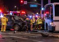 Emergency crews at a Santa Clarita intersection after a pickup truck collided with a bus, with the damaged vehicles and responders visible in the background.