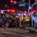 Emergency crews at a Santa Clarita intersection after a pickup truck collided with a bus, with the damaged vehicles and responders visible in the background.