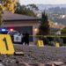 Close-up of police evidence markers and a blurred residential hillside scene near Oakland’s Panoramic Hill, illustrating a fatal shooting investigation.