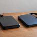 Close-up of two external hard drives side by side on a plain wooden table in soft indoor daylight, illustrating a Ventura County digital evidence case.