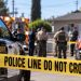 Daytime law enforcement response outside a Cudahy residence, with sheriff’s vehicles, emergency responders and investigators blurred behind police tape.
