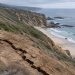 High view of a long crack in a dry coastal hillside below Pacific Coast Highway above Moro Beach near Laguna Beach in neutral daylight.