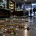 Jewelry chains and rings scattered among shattered glass on the floor of a dim jewelry shop interior, illustrating a Downtown Los Angeles burglary.