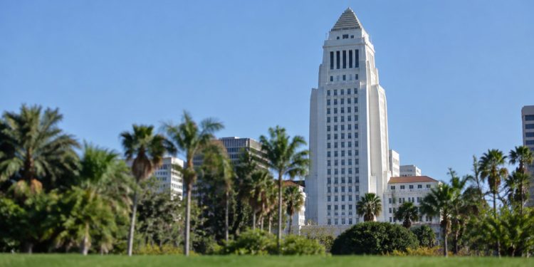 Los Angeles City Hall tower in neutral daylight above softly blurred palm trees, illustrating the 2026 Los Angeles mayoral race.