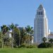 Los Angeles City Hall tower in neutral daylight above softly blurred palm trees, illustrating the 2026 Los Angeles mayoral race.