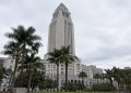 Los Angeles City Hall tower in neutral daylight above softly blurred palm trees, illustrating the 2026 Los Angeles mayoral race.