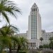Los Angeles City Hall tower in neutral daylight above softly blurred palm trees, illustrating the 2026 Los Angeles mayoral race.