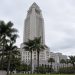 Los Angeles City Hall tower in neutral daylight above softly blurred palm trees, illustrating the 2026 Los Angeles mayoral race.